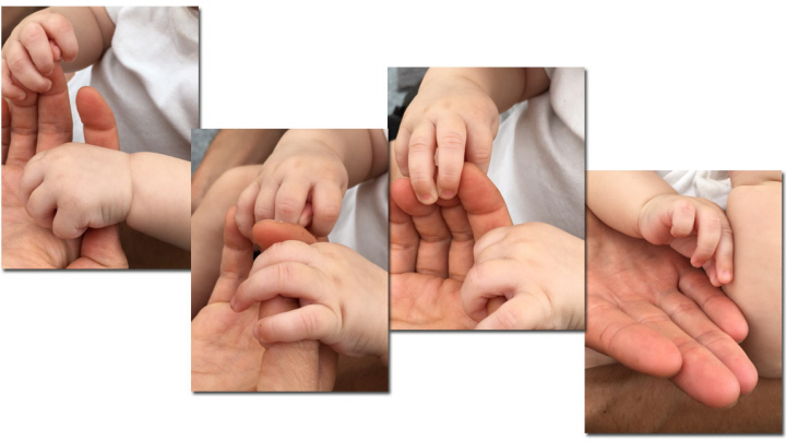 Barnhänder i en vuxen människas händer, de kommunicerar taktilt.