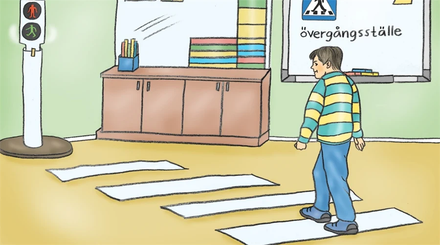 Illustration av ett rum där en pojke går på ett övergångsställe. Framför övergångsstället ser vi ett rödljus, en bänk och en tavla där det står 